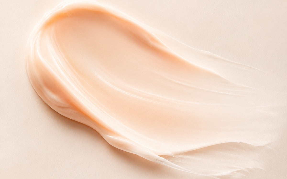 Peach pink skincare cream texture